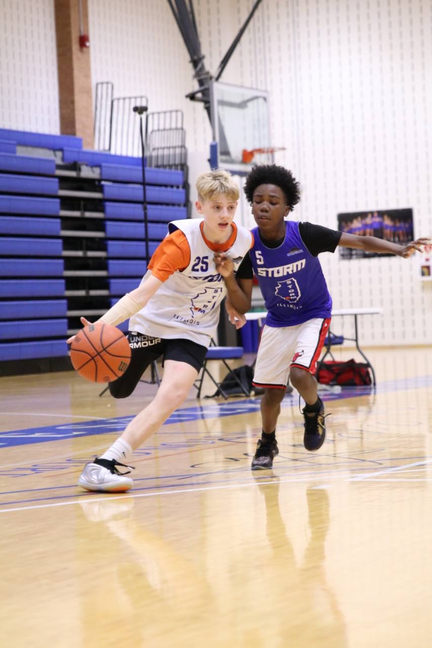 Two Storm Basketball players practicing an attack and on-ball defense on the court